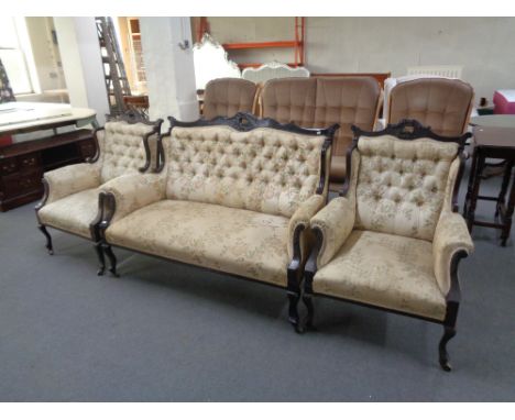 A three piece Edwardian mahogany framed lounge suite upholstered in floral tapestry covering 