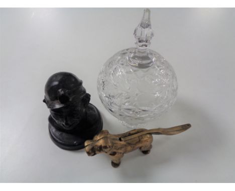 A vintage brass nut cracker in the form of a dog together with a polished coal figure of a miner and glass lidded dish 