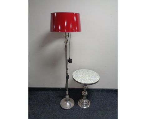 A contemporary metal standard lamp with red shade, together with a contemporary wine table with faux pearl top 