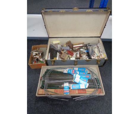 An early twentieth century trunk with lift out tray containing model railway accessories including Duette twin supply power u