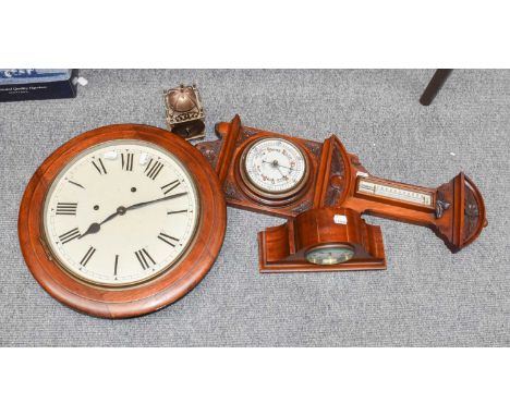 A Victorian mahogany striking wall clock with twelve inch painted dial, together with a carved walnut barometer, an Edwardian