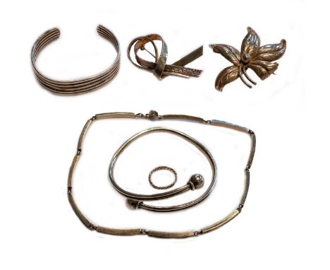 A bangle and a brooch, stamped 'STERLING DENMARK; another bangle and necklace, stamped 'STERLING'; together with a ring and a