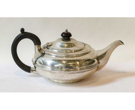 An Edward VII Silver Teapot, by John Bodman Carrington, London, 1904, compressed globular and with reeded band, on collet foo