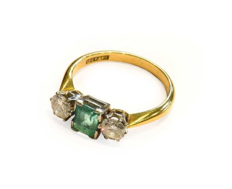 An emerald and diamond three stone ring, stamped '18CT&amp; PT', finger size K1/2Condition report: The ring is in good condit