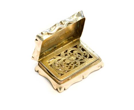 A Victorian Silver Vinaigrette, by Thomas Dones, Birmingham, 1850, shaped oblong, the hinged cover engine-turned and centring