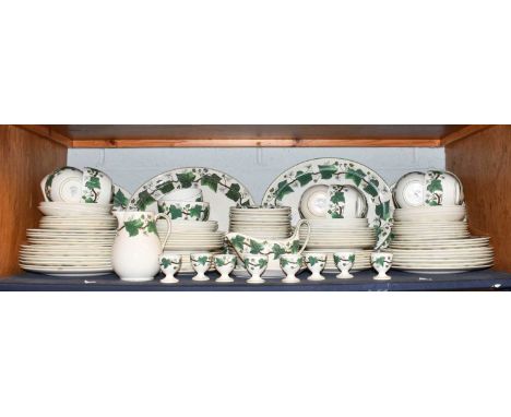 A Wedgwood pottery Napoleon Ivy pattern dinner and tea service including dinner plates, sauceboat, tea cups and saucers and e