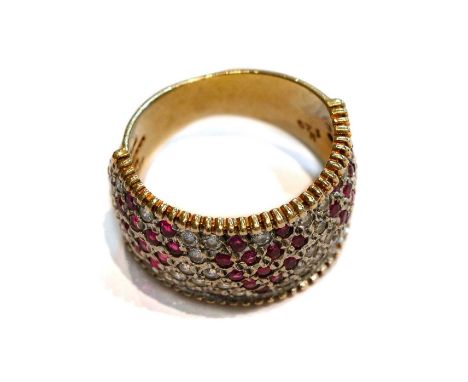 A 9 carat gold ruby and white stone ring, three heart-shaped motifs formed of round cut rubies within a rectangular border of