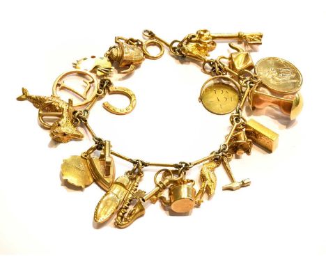 A fancy link bracelet, stamped '9CT', hung with various charms including an artists palette, a kettle, a fish, an iron, an an