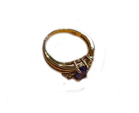A tanzanite and diamond ring, stamped '14K', finger size LCondition report: Gross weight 3.5 grams.