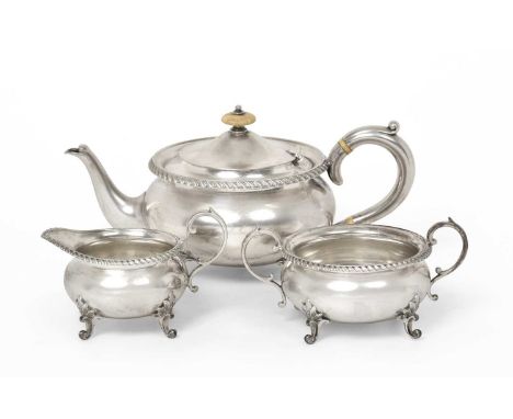 A Three-Piece Victorian Silver Tea-Service, by Horace Woodward &amp; Co Ltd., London, 1898, each piece compressed circular an