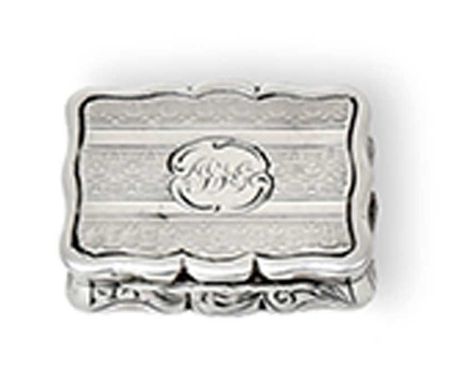 A Victorian Silver Vinaigrette, by Edward Smith, Birmingham, 1853, shaped oblong, the hinged cover engine-turned and centring