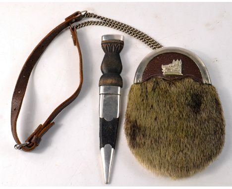 Vintage 1950's child's sporran with a boar motif, nice example,  and a child size Edinburgh silver hallmarked dirk, again, an