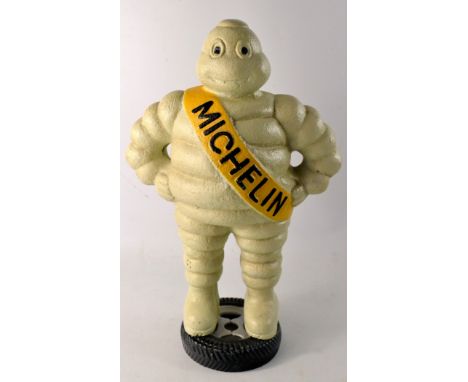 Michelin man standing on a tyre model. Marked Detroit reg 1918 to back sash. Possibly cast iron.W: 25cm approx  D: 12.5cm app