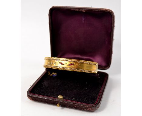 Victorian yellow metal ruby and pearl set bangle D: 6.5cm approx Gross weight approx 18.4g