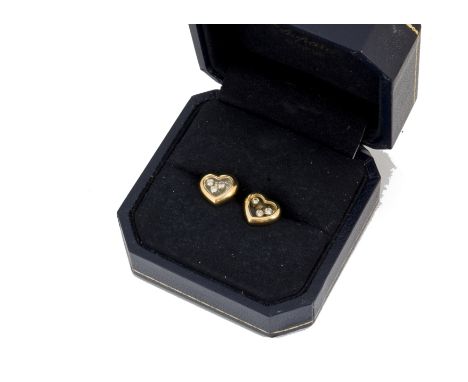 A pair of Chopard heart shaped Happy Diamond earrings, the ear studs set with three floating brilliant cut diamonds with post