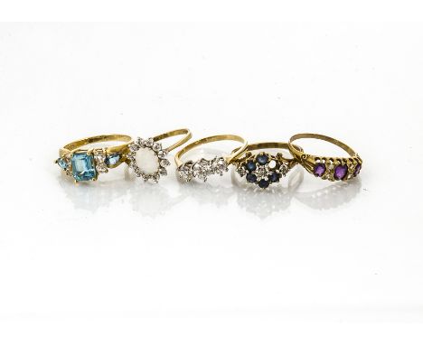 A collection of five 9ct gold gem set dress rings, including amethyst, aquamarine, sapphire and opal examples, total weight 1