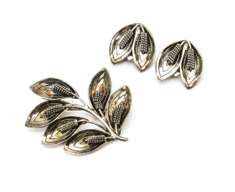 A Danish modernist brooch and earring set, By Raare &amp; Krogh, of leaf design, the earrings with clip backs stamped A &amp;