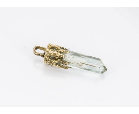 A modernist aquamarine and gold mounted pendant, the light blue semi natural state aquamarine with pyramid pinacoid with gold