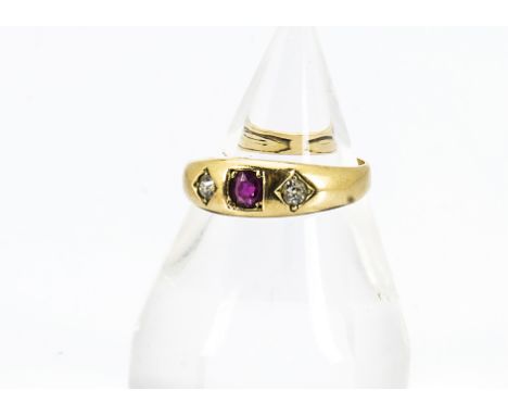 A Victorian 18ct gold diamond and ruby three stone ring, centred with oval ruby and two old cut diamonds ring size P, 3.7g 