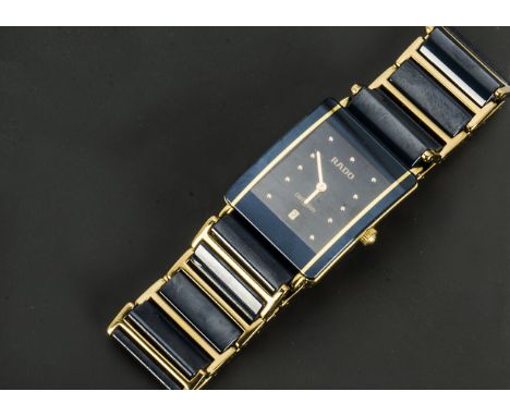 A 1990s Rado Diastar ceramic and gilt gentleman's wristwatch, 25mm case, ref. 160.0281.3 N, appears to run, with box and wall
