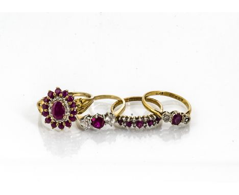 A 9ct gold ruby and diamond cluster ring, an 18ct gold three stone ruby and diamond ring, (af) and two others, 10g 