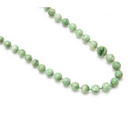 A graduated string of jadeite Jade knotted beads, light green, largest 10.5mm diameter, smallest 4.2mm diameter, 57g 