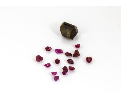 A small collection of ruby crystals, and a part tourmaline crystal 