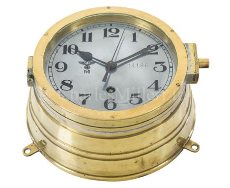 A KRIEGSMARINE U-BOAT CLOCKthe 6¼in. silvered dial marked with Kriegsmarine device and numbered ‘14186’, black spade hands wi