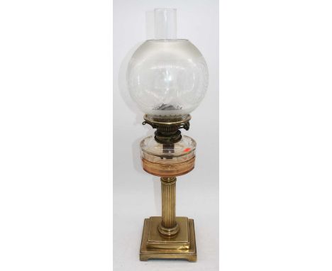 A 19th century brass oil lamp, having acid etched glass shade, overall h.64cm 