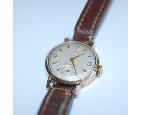 A lady's Cyma 9ct gold cased vintage manual wind wristwatch, having signed champagne dial and engraved to the back cover, cir