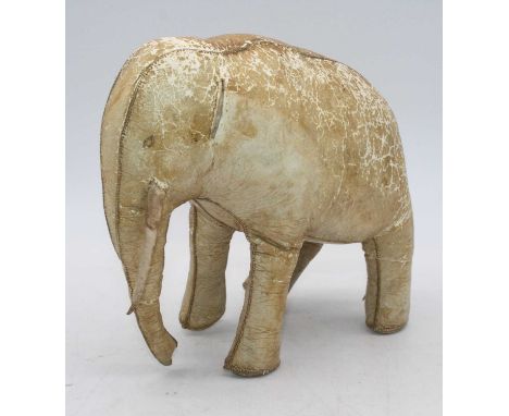A vintage kid leather model of an elephant, h.20cmRight tusk is hanging off.Missing left ear.Otherwise no rips or tears.