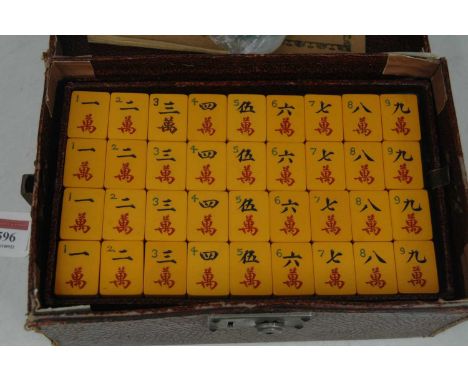A mah-jong set from the Chun Wah Trading Company of Shanghai, in original box, w.25cm148 tiles; 144 and four blanks.Orange co