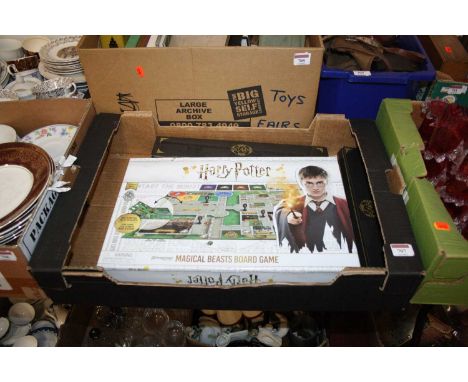 A Harry Potter Magical Beasts board game, together with toy magic wands