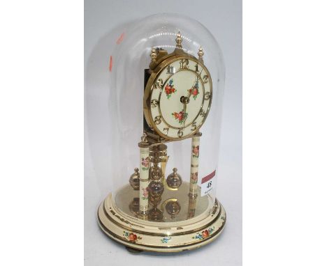 A 20th century floral decorated anniversary clock, housed under a glass dome, h.23cm 