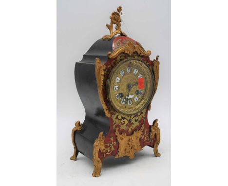 A 19th century French brass inlaid faux tortoiseshell mantel clock, the dial showing Roman enamel numerals, the case having g