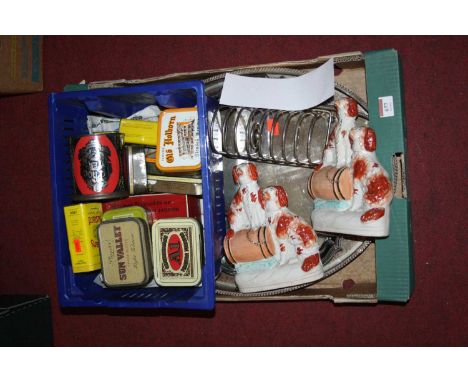 A collection of miscellaneous items to include a pair of Staffordshire flat back models of spaniels, vintage tobacco tins, an