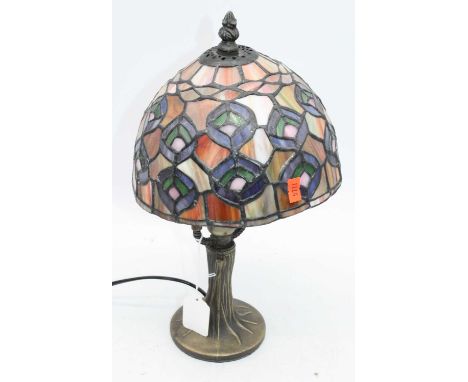 A 20th century Tiffany style table lamp, having coloured glass shade, h.35cm 