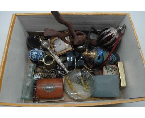 A box of miscellaneous items, to include a small bronze alloy figure of Ganesh, a Norfolk Regiment cap badge, ambrotype portr