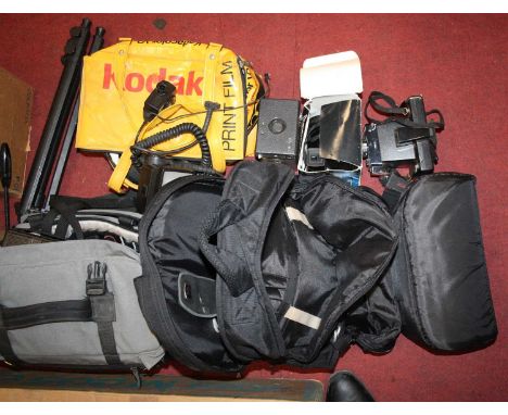A large collection of photography equipment, to include a camera, an enlarger, lenses etc