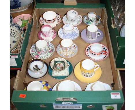 A box of porcelain coffee cans and saucers to include Wedgwood and Royal Worcester