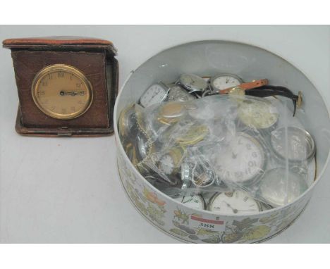 A 1930s leather clad travel clock together with various base metal cased pocket watches, watch movements, wrist watches etc