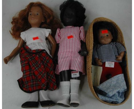 Three Swedish Sasha dolls, circa 1970s, all in original clothing, the tallest h.44cmLarger doll tartan is ripped to tights an