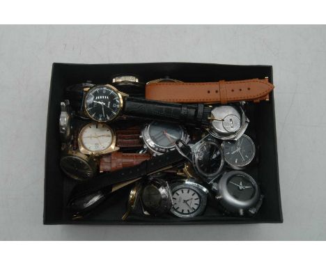 A gent's Timex quartz wristwatch, having a silvered dial with baton markers, day and date aperture, on brown leather strap; t