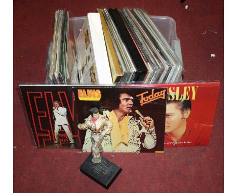 A box of vintage records and collectables relating to Elvis Presleyextra images