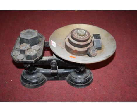 A vintage set of cast iron scales