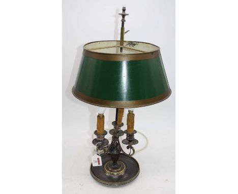 A 19th century silver plated three-branch table lamp, later converted for electricity, having a green toleware type shade, h.