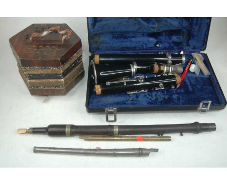 A box of musical instruments, to include hand accordion, clarinet, flutes etc 