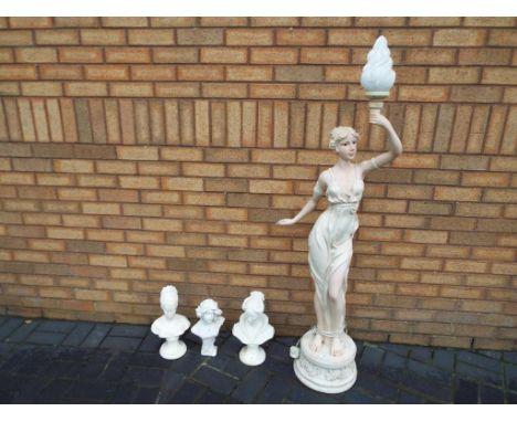 A large floor lamp depicting a lady holding aloft the bulb, approximately 136 cm (h) (without shade) and three busts depictin