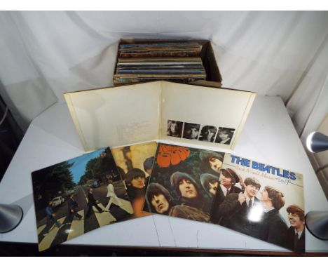 Vinyl Records - in excess of thirty 33.3 RPM record albums to include The Beatles Rubber Soul, The Beatles For Sale and The B