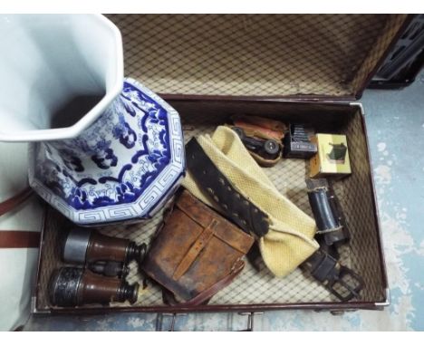 A vintage suitcase by Vulkan containing a pair of vintage binoculars in leather case, Opera glasses, a ceramic blue and white